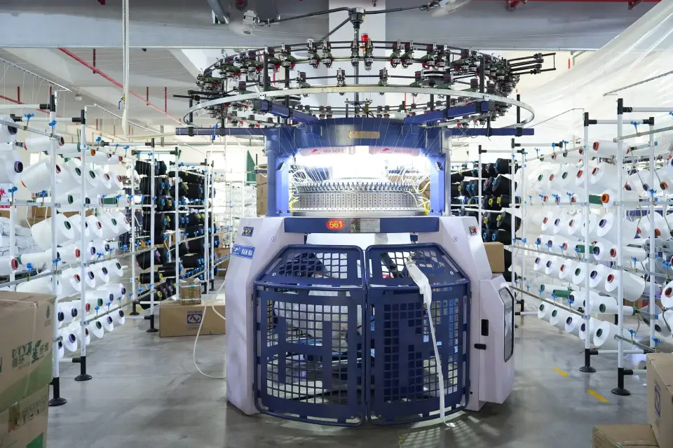 Advanced textile knitting machines at Huada Creation factory